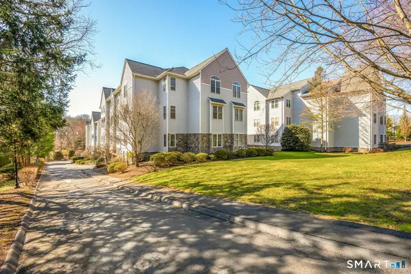 a front view of residential houses with yard