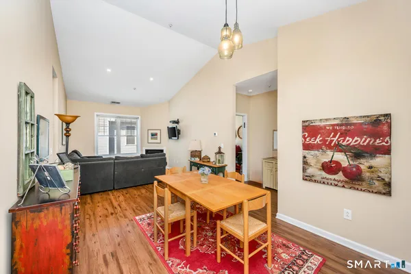 a living room with dining table