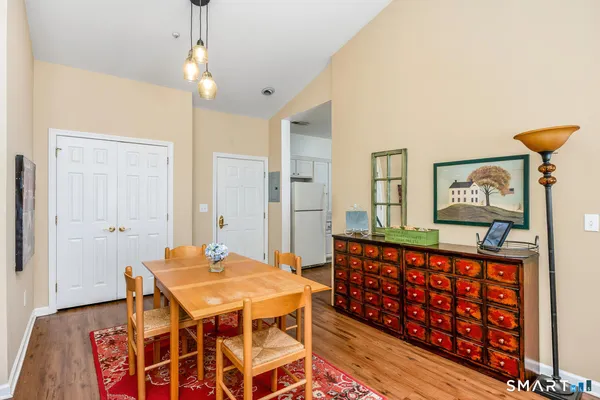 a bedroom with a bed and a table in it