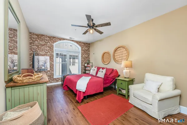 a living room with furniture a rug and a window