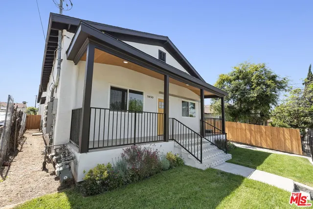 a view of backyard with a garden and deck