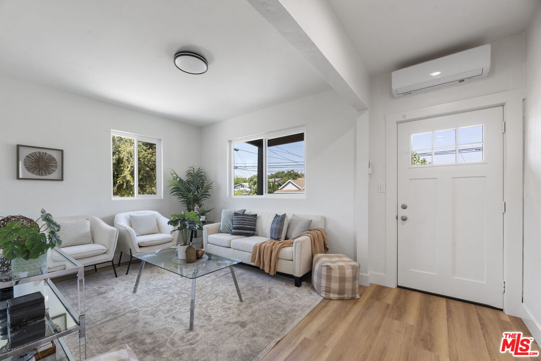 1450 Ricardo Street Los Angeles, CA 90033 - Photo 2 of 19 a living room with furniture and wooden floor