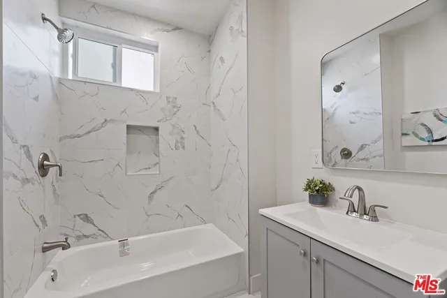 a bathroom with a sink and a bathtub
