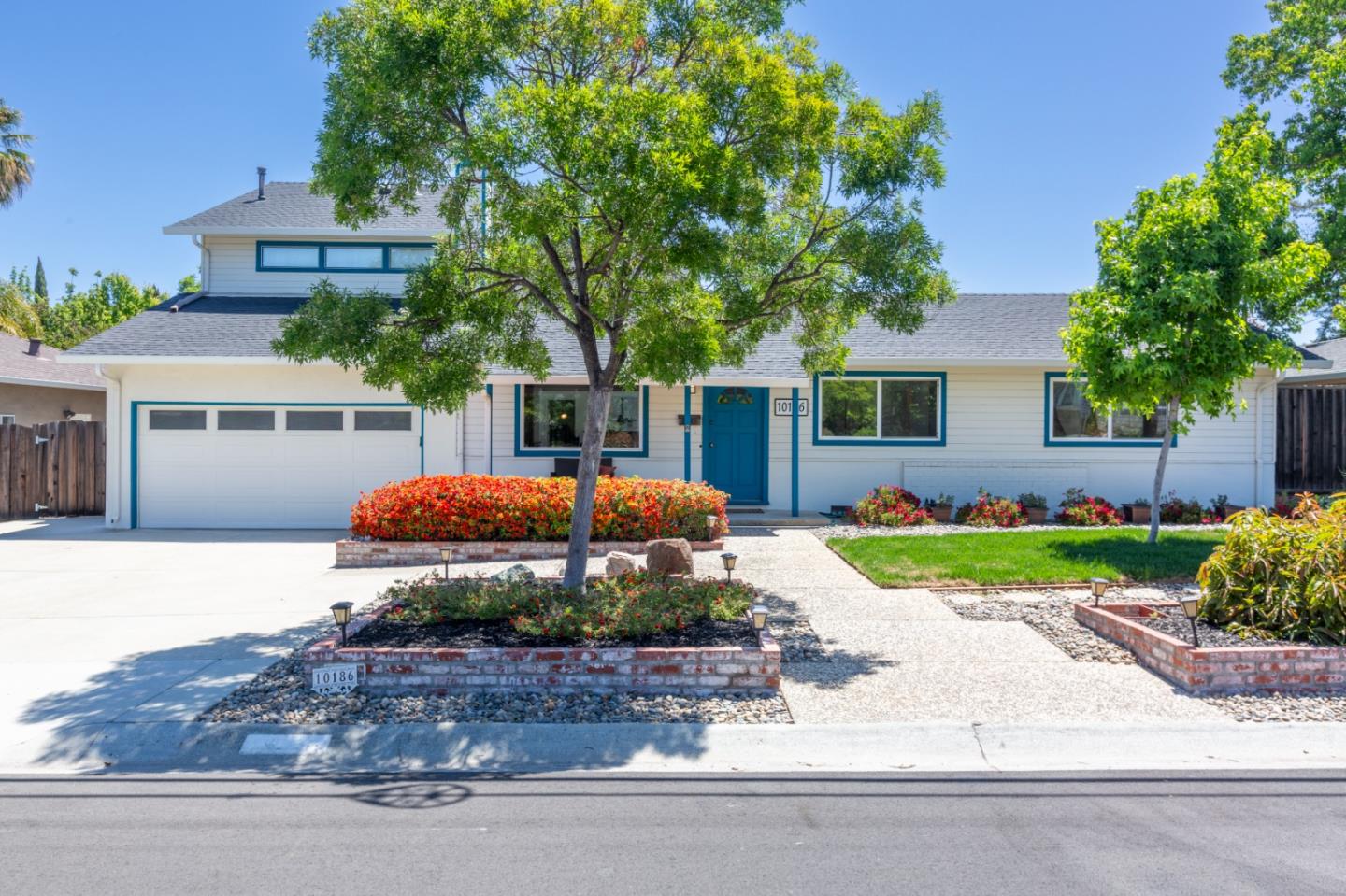 10186 Mann Drive Cupertino, CA 95014 - Photo 1 of 1 front view of a house with a yard