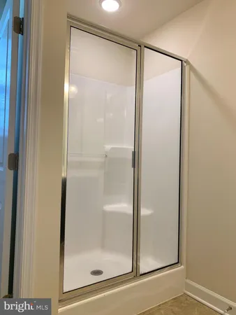 a bathroom with a sink double vanity and a mirror