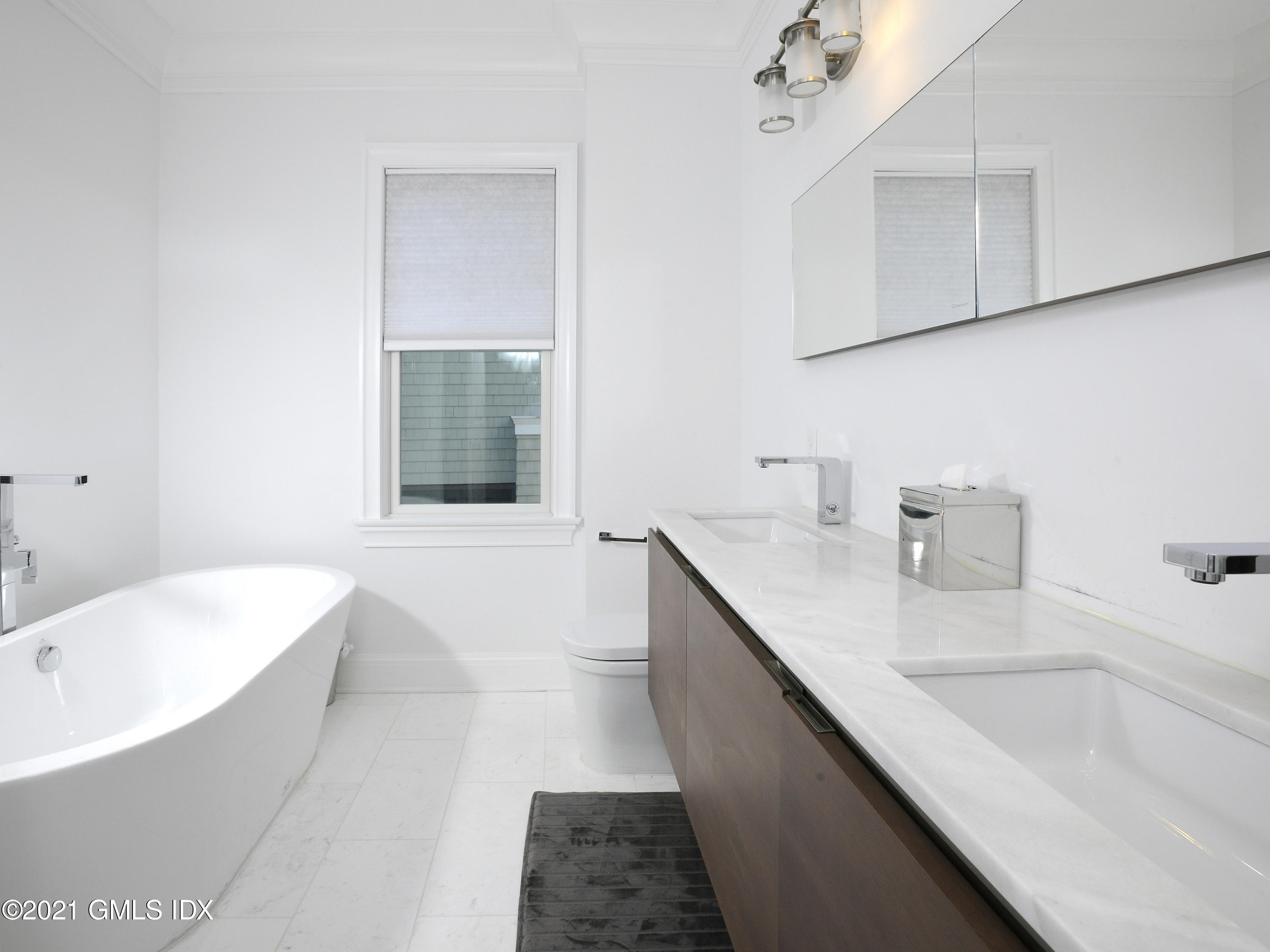 1 Home Place, Unit B Greenwich, CT 06830 - Photo 11 of 26 a bathroom with a tub sink and mirror