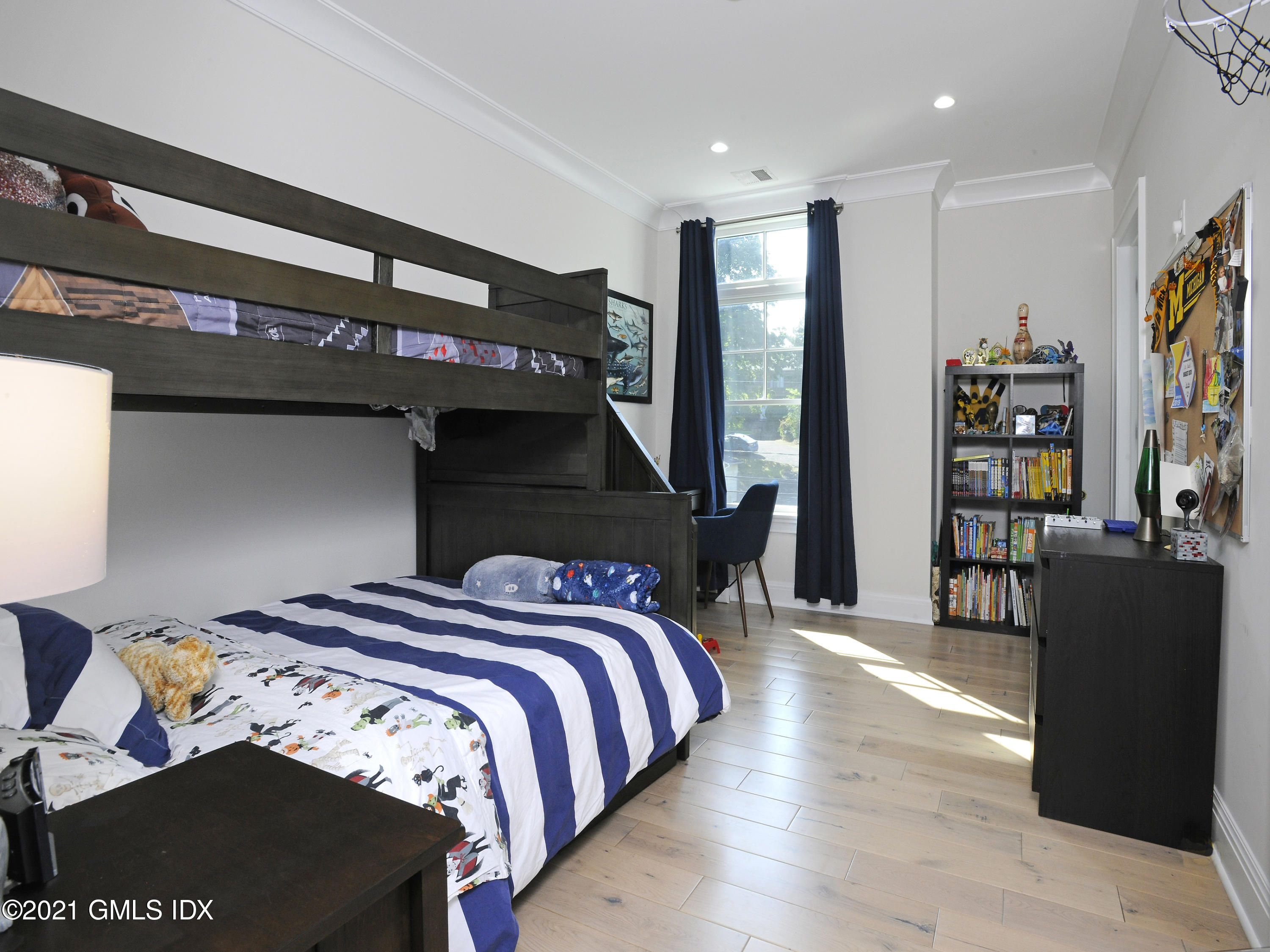 1 Home Place, Unit B Greenwich, CT 06830 - Photo 12 of 26 a bedroom with a bed and a book shelf