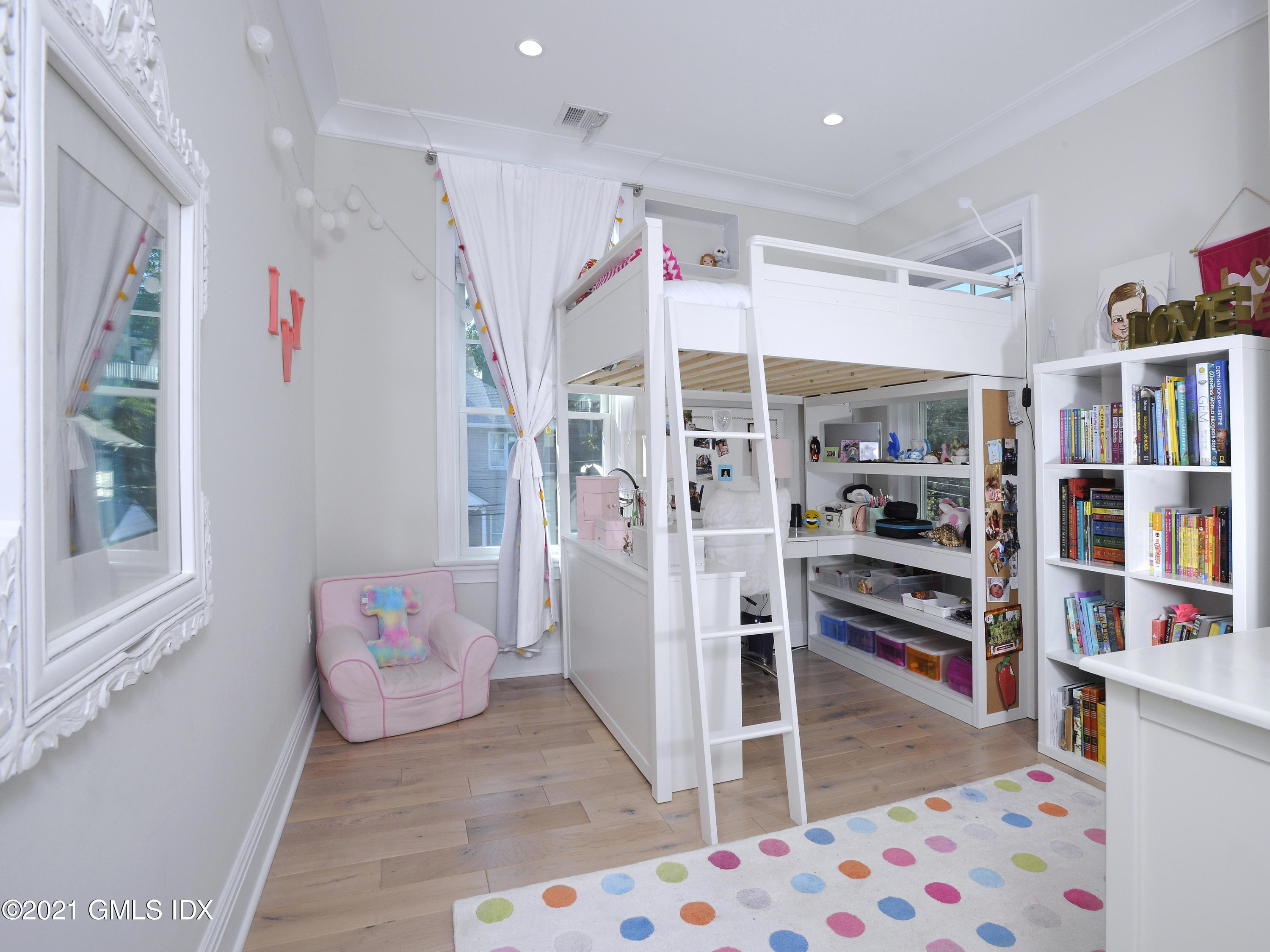1 Home Place, Unit B Greenwich, CT 06830 - Photo 13 of 26 a bedroom with furniture and a book shelf