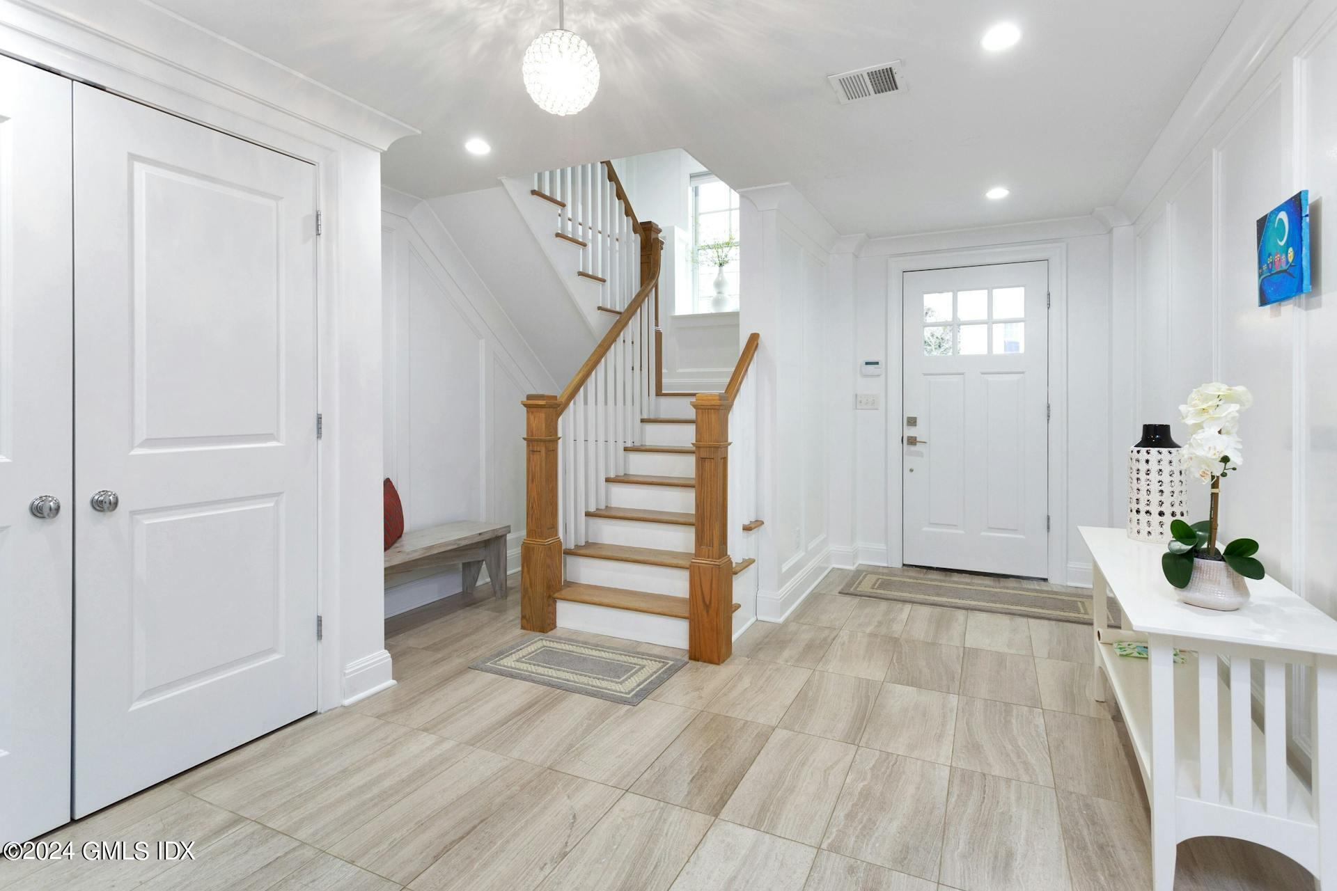 1 Home Place, Unit B Greenwich, CT 06830 - Photo 14 of 26 a view of a hallway view with wooden floor and staircase