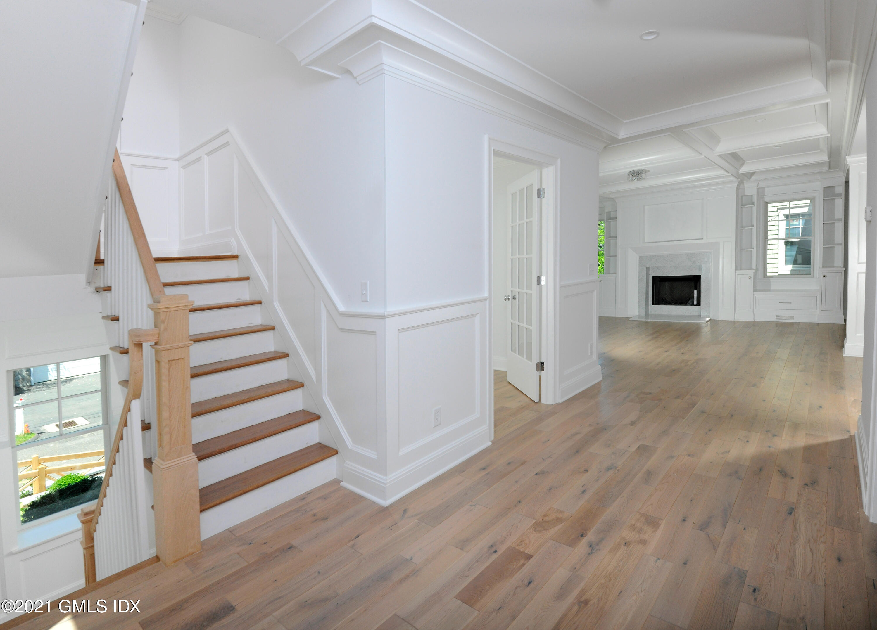 1 Home Place, Unit B Greenwich, CT 06830 - Photo 2 of 26 a view of a livingroom with wooden floor and stairs