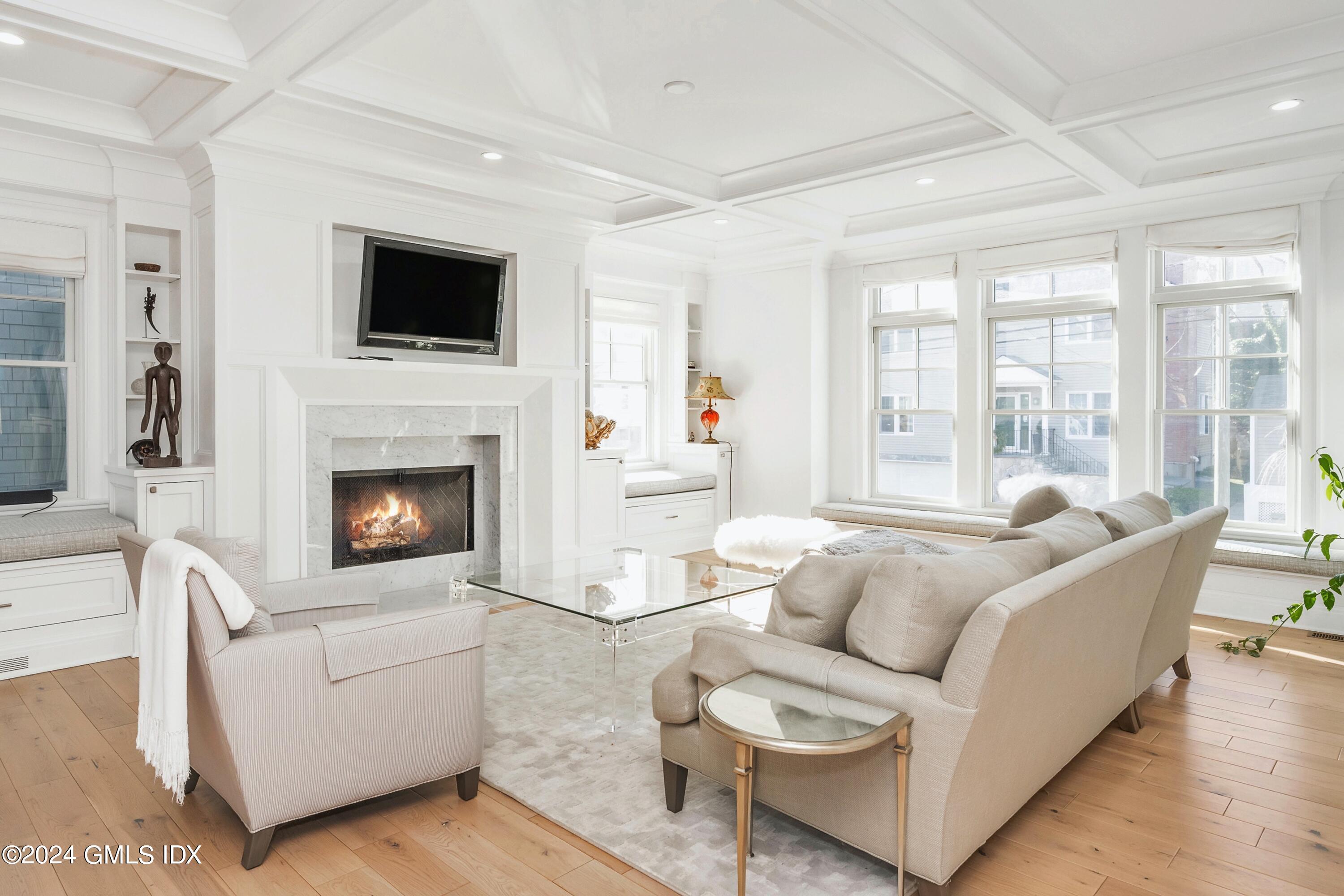 1 Home Place, Unit B Greenwich, CT 06830 - Photo 3 of 26 a living room with furniture a flat screen tv and a fireplace