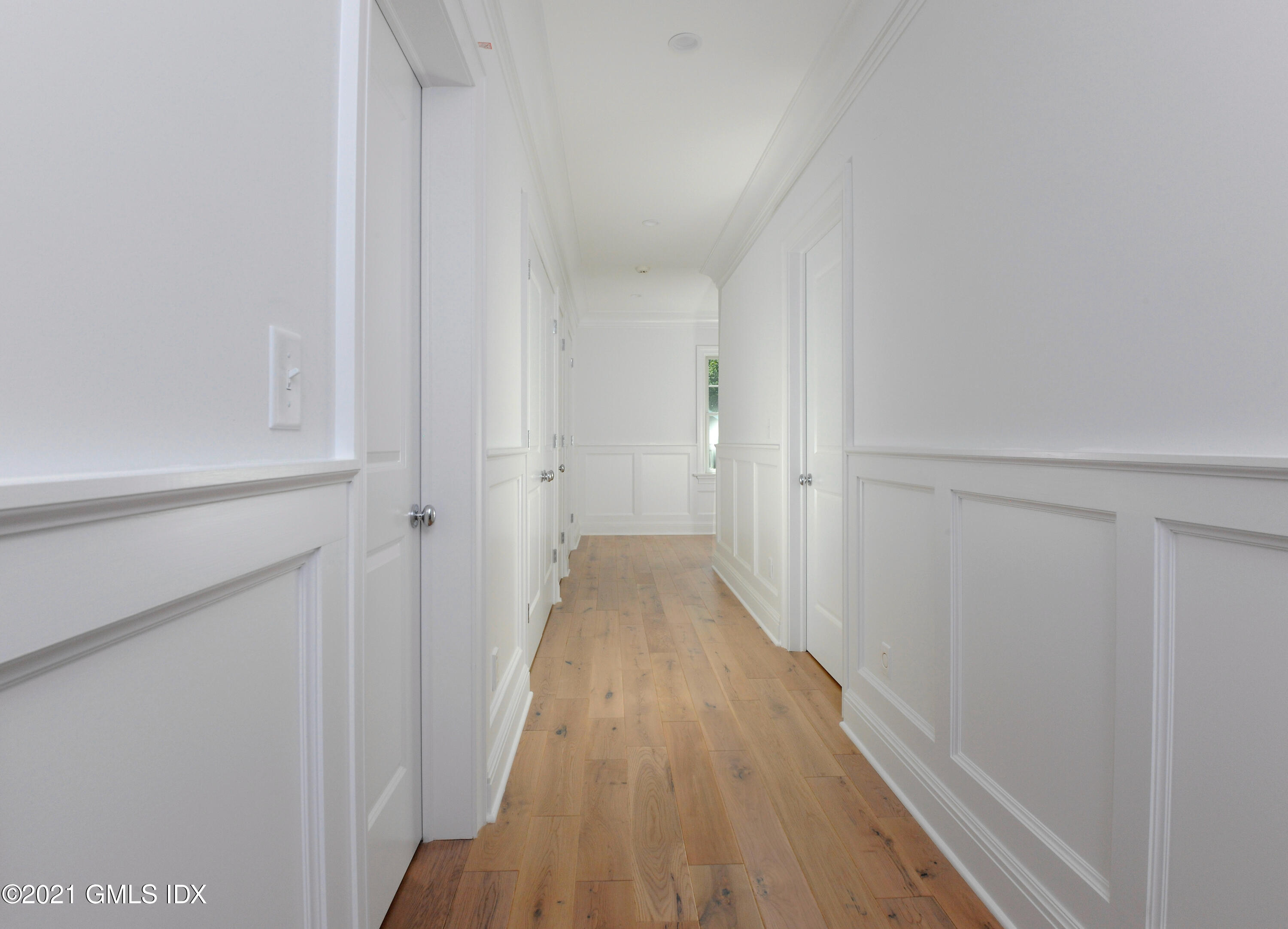 1 Home Place, Unit B Greenwich, CT 06830 - Photo 9 of 26 a view of a hallway with wooden floor