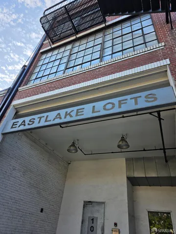 a view of parking garage with cars
