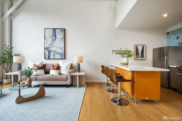 a living room with furniture and a table