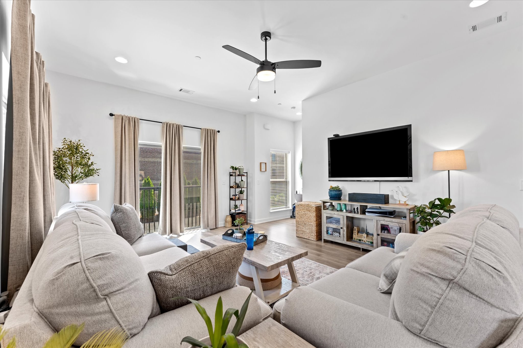 211 Folsom Pass, Unit B Spring Hill, TN 37174 - Photo 11 of 24 a living room with furniture and a flat screen tv