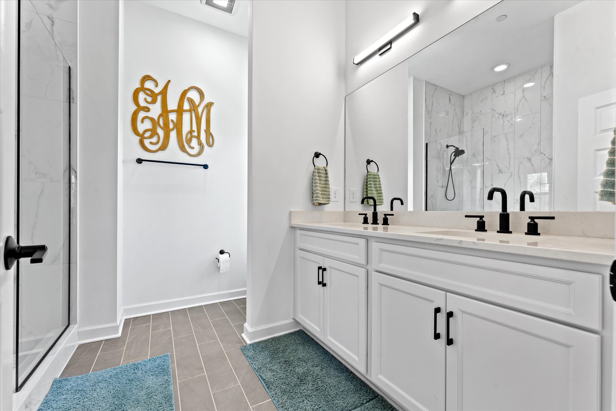 211 Folsom Pass, Unit B Spring Hill, TN 37174 - Photo 15 of 24 a spacious bathroom with a sink a mirror and a shower