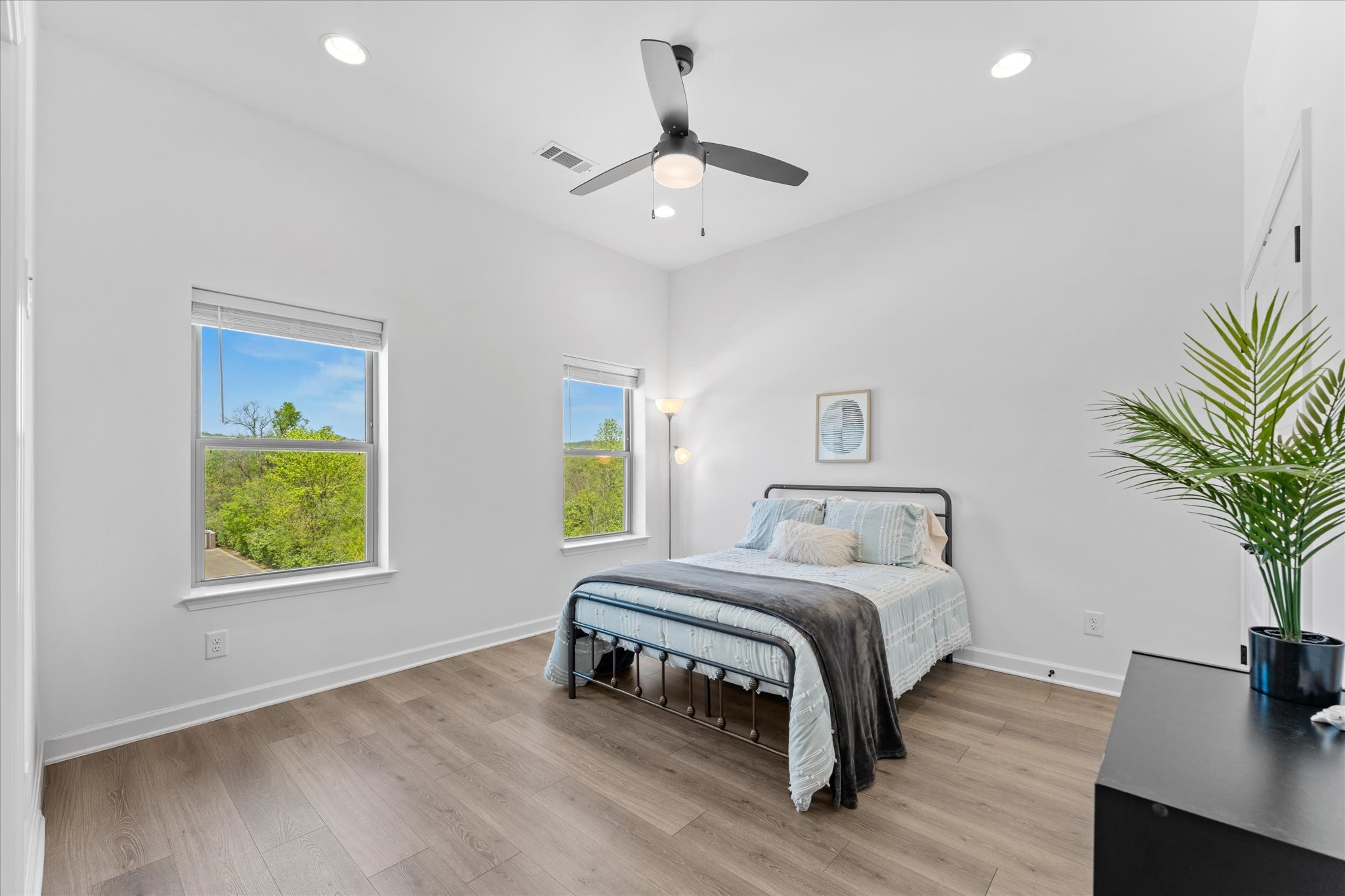 211 Folsom Pass, Unit B Spring Hill, TN 37174 - Photo 17 of 24 a bedroom with a bed and a potted plant on the dresser