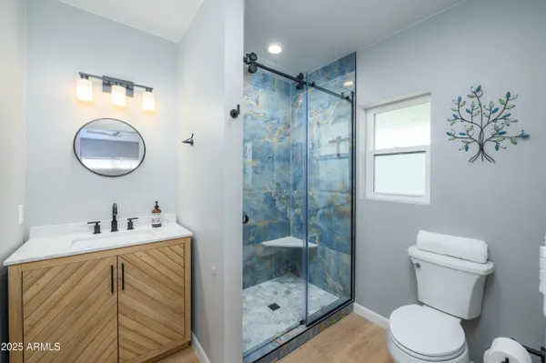 a bathroom with a sink toilet and shower