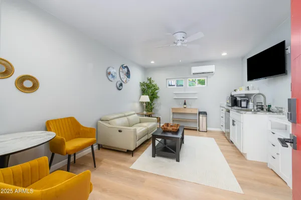 a living room with furniture and a flat screen tv