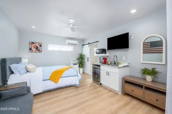 a living room with furniture and flat screen tv