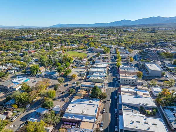an aerial view of residential houses with outdoor space