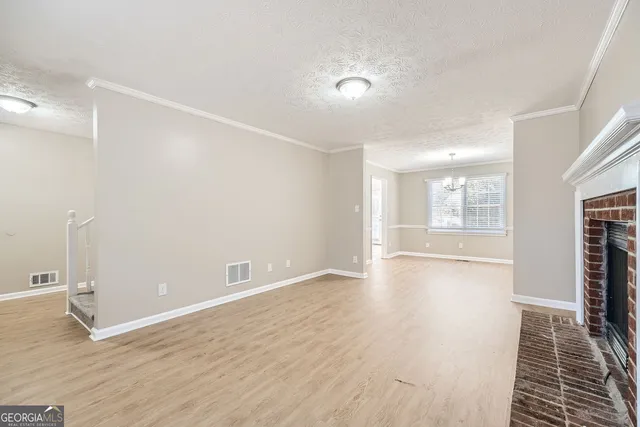 a kitchen with white cabinets appliances and sink
