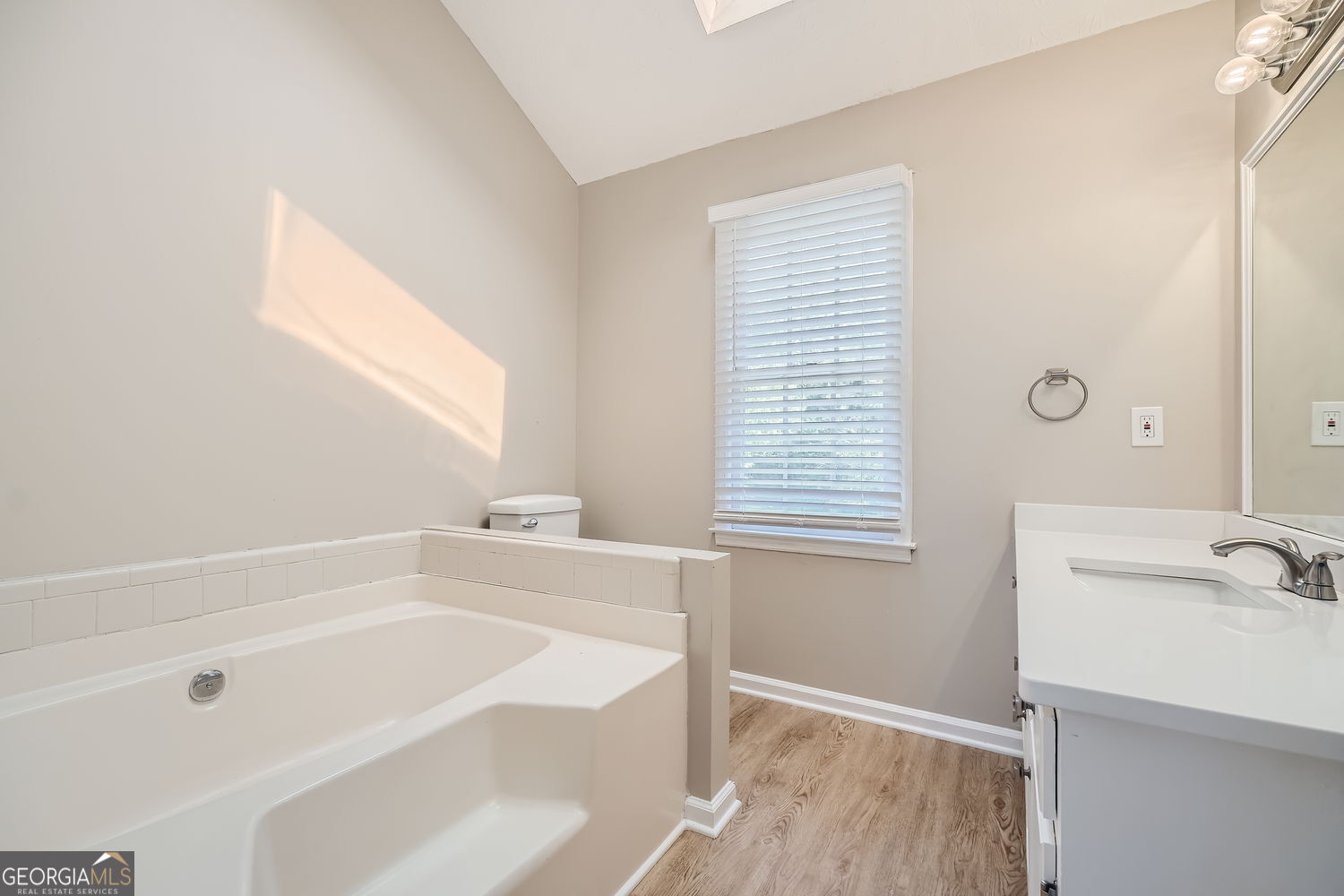 849 Ridge Avenue Stone Mountain, GA 30083 - Photo 7 of 11 a bathroom with a bathtub and a sink