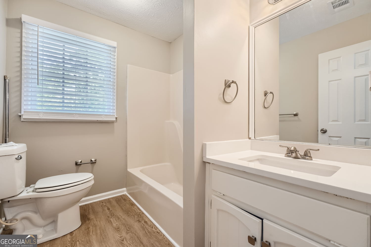 849 Ridge Avenue Stone Mountain, GA 30083 - Photo 9 of 11 a bathroom with a sink toilet and shower