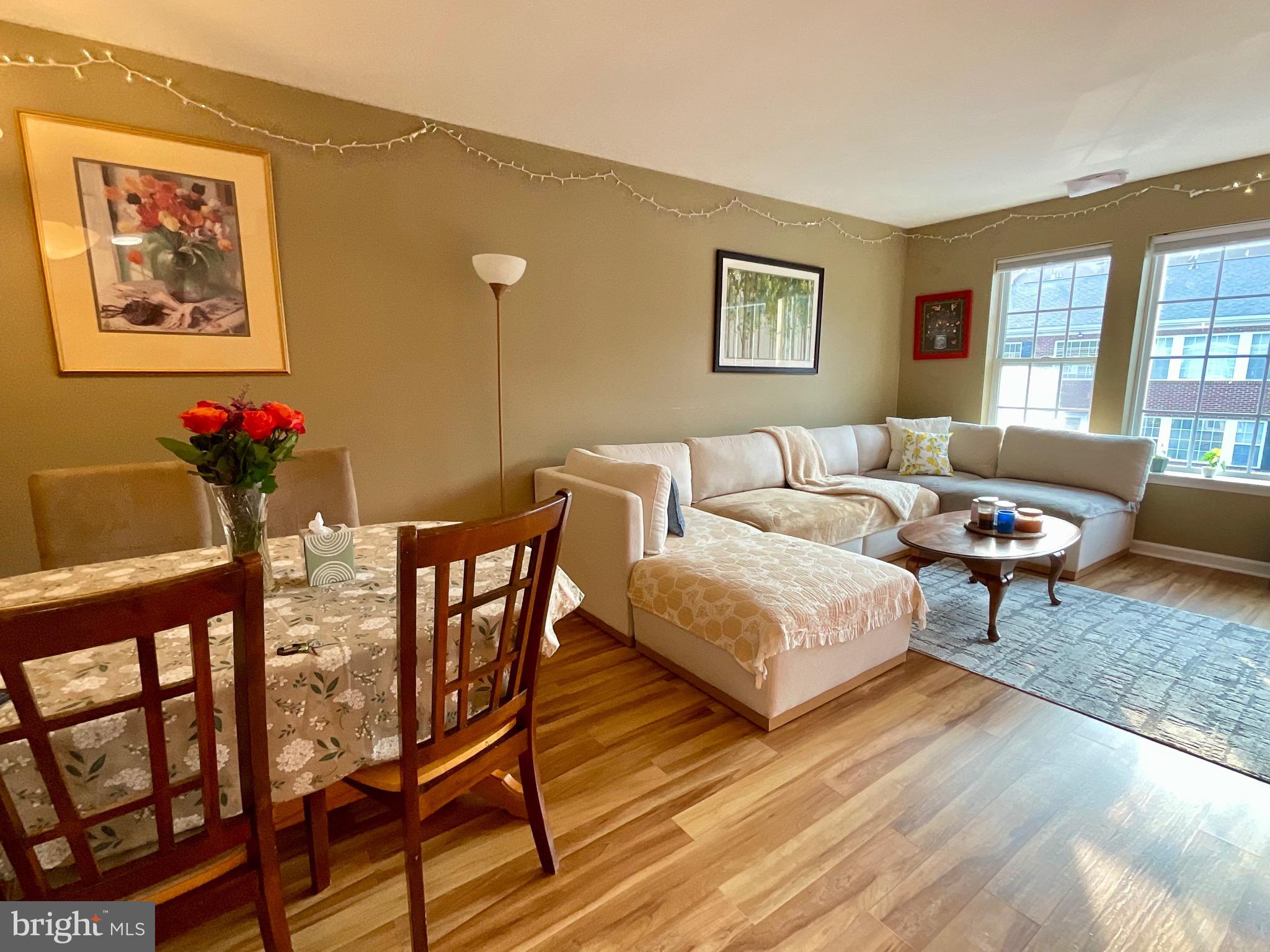 9228 Blue Grass Road, Unit 38 Philadelphia, PA 19114 - Photo 4 of 11 a living room with furniture and wooden floor