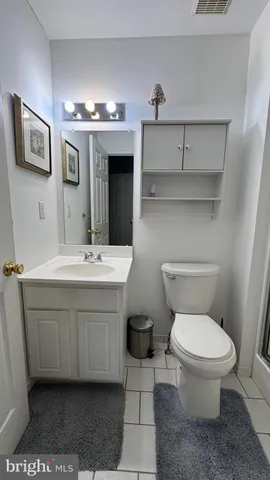 a kitchen with stainless steel appliances granite countertop a refrigerator a stove and a refrigerator