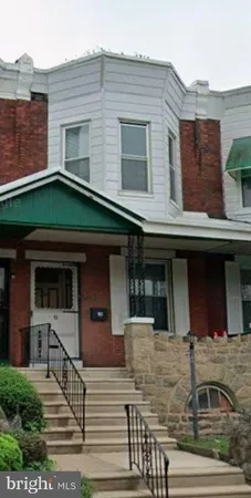 a front view of a house with garage