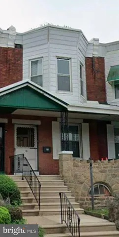 a front view of a house with garage