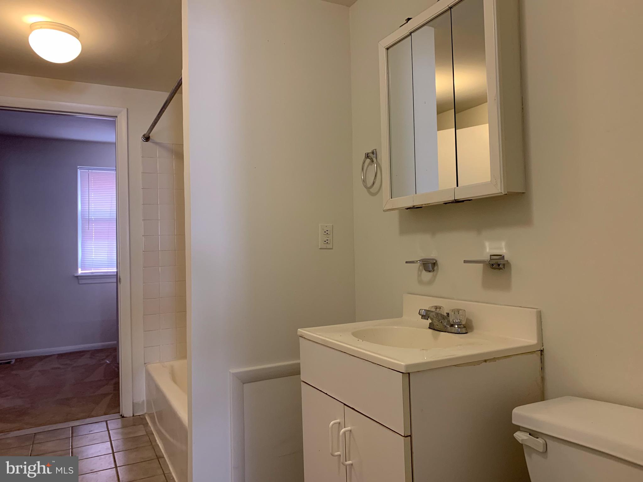 1203 Locust Street, Unit 1F Philadelphia, PA 19107 - Photo 13 of 15 a utility room with dryer and washer