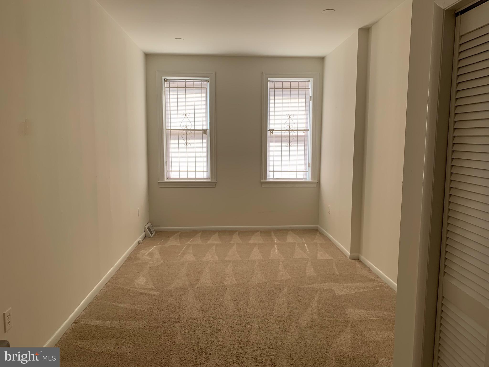 1203 Locust Street, Unit 1F Philadelphia, PA 19107 - Photo 2 of 15 a view of an empty room and window
