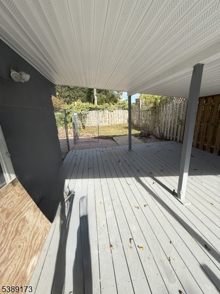 62 Wolfe Road, Unit 63 Budd Lake, NJ 07828 - Photo 16 of 19 a view of balcony with wooden floor