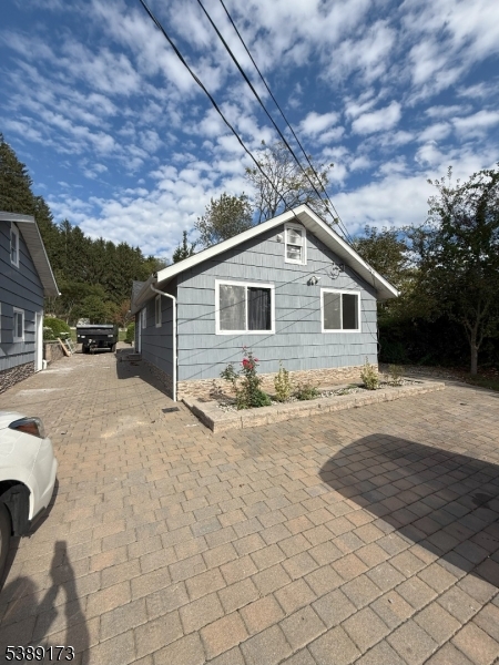 62 Wolfe Road, Unit 63 Budd Lake, NJ 07828 - Photo 18 of 19 a view of a house with a yard