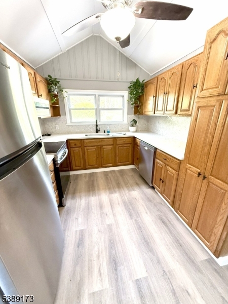 62 Wolfe Road, Unit 63 Budd Lake, NJ 07828 - Photo 2 of 19 a bathroom with a sink a bathtub and a window