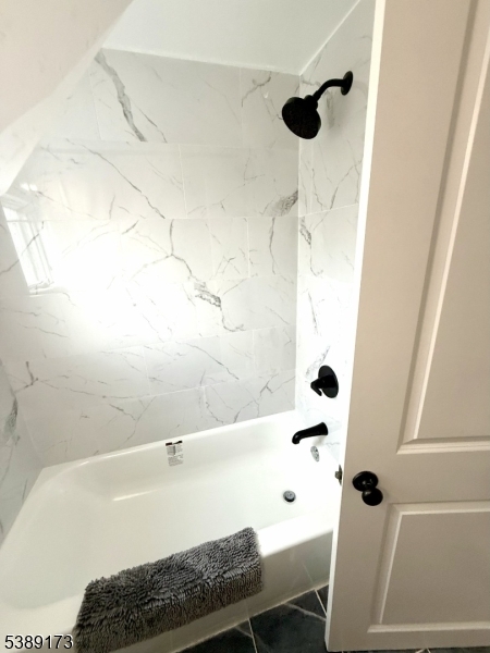 62 Wolfe Road, Unit 63 Budd Lake, NJ 07828 - Photo 10 of 19 a bathroom with a bathtub and a shower