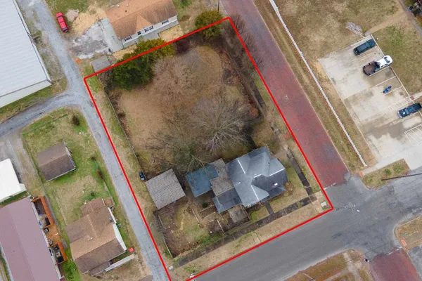 an aerial view of residential houses with outdoor space