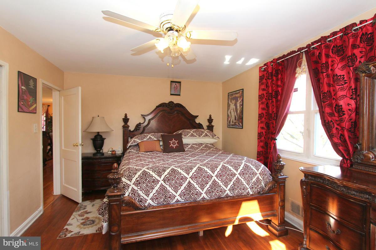 224 University Boulevard East Silver Spring, MD 20901 - Photo 17 of 30 a bedroom with a bed and a window