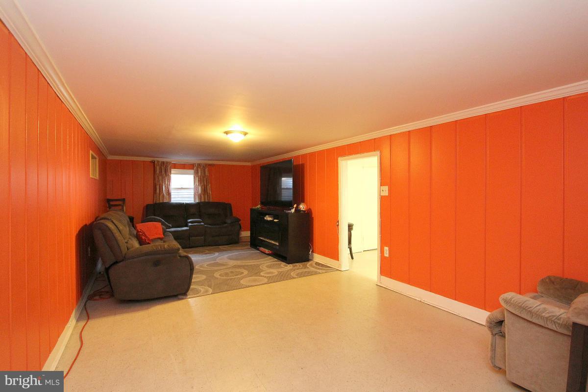 224 University Boulevard East Silver Spring, MD 20901 - Photo 20 of 30 a living room with furniture and a large window