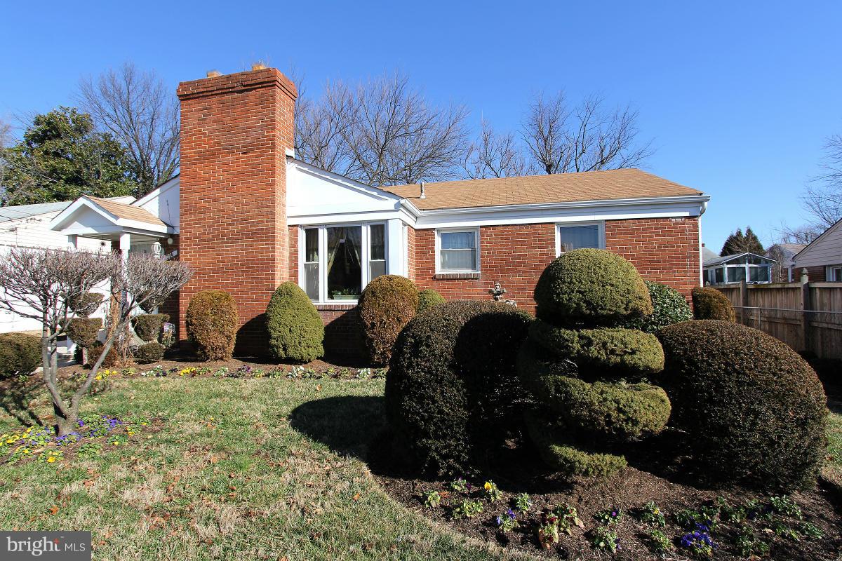 224 University Boulevard East Silver Spring, MD 20901 - Photo 2 of 30 a view of a house with a yard and sitting area