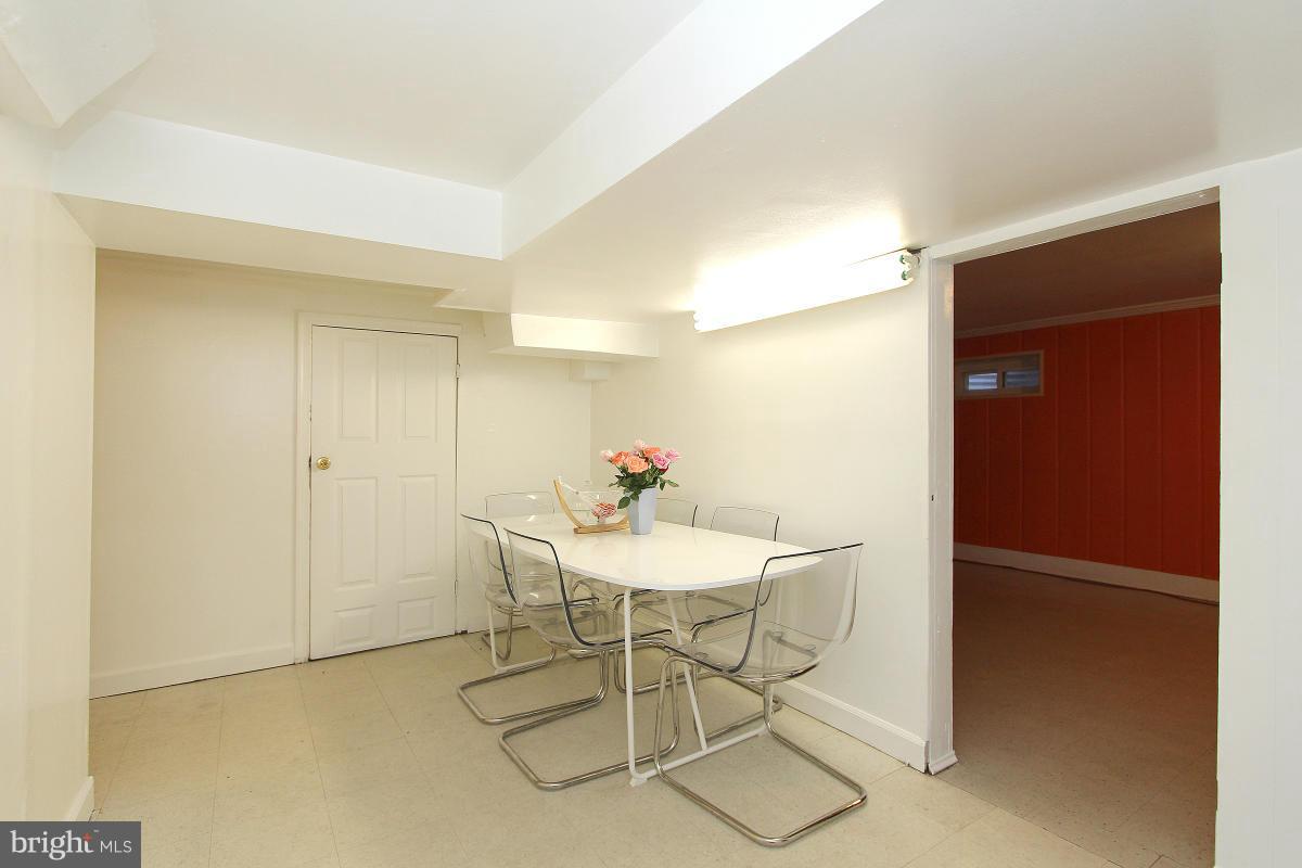 224 University Boulevard East Silver Spring, MD 20901 - Photo 22 of 30 a view of a dining room with furniture and a potted plant