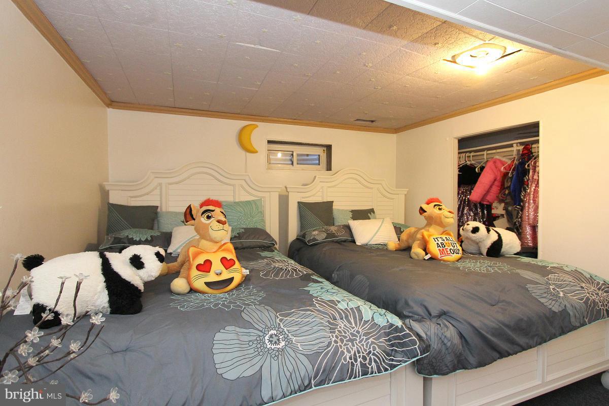 224 University Boulevard East Silver Spring, MD 20901 - Photo 23 of 30 a bedroom with furniture and a tv