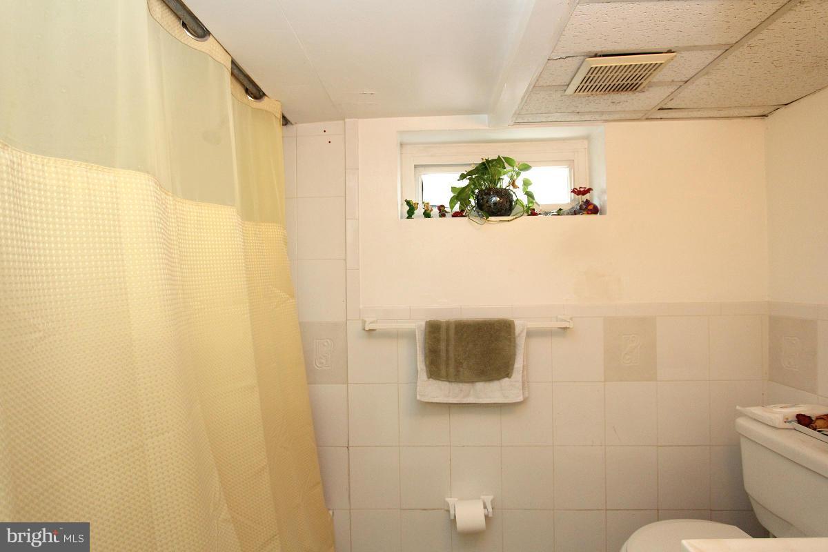 224 University Boulevard East Silver Spring, MD 20901 - Photo 24 of 30 a bathroom with a sink and a mirror