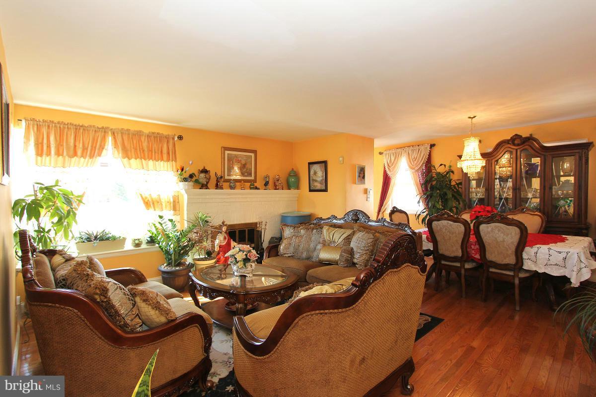 224 University Boulevard East Silver Spring, MD 20901 - Photo 3 of 30 a living room with furniture and a large window