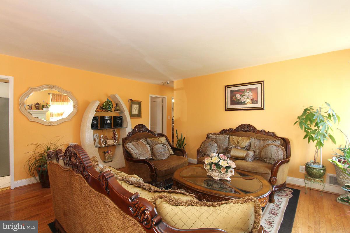 224 University Boulevard East Silver Spring, MD 20901 - Photo 4 of 30 a living room with furniture and a table