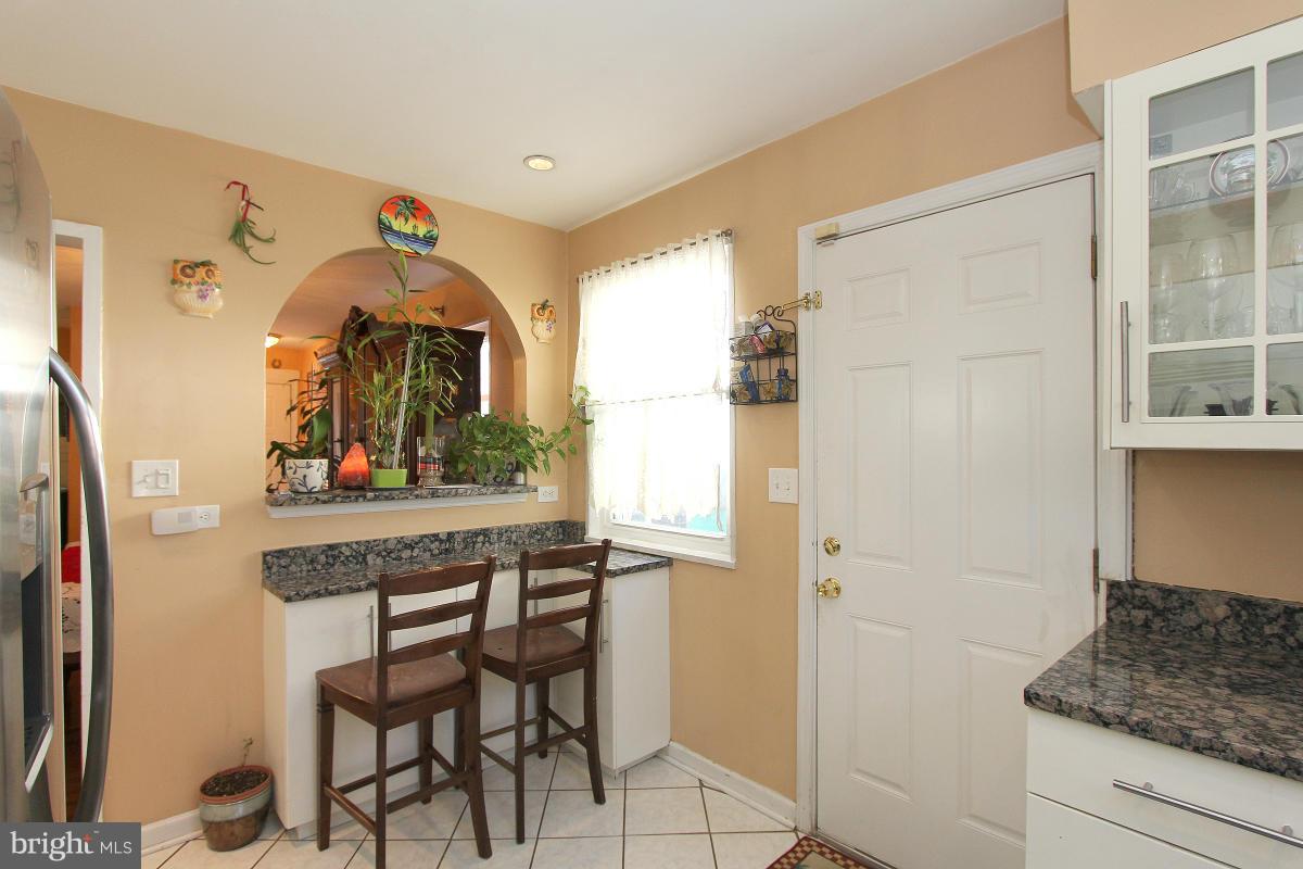 224 University Boulevard East Silver Spring, MD 20901 - Photo 9 of 30 a view of kitchen with furniture and wooden floor