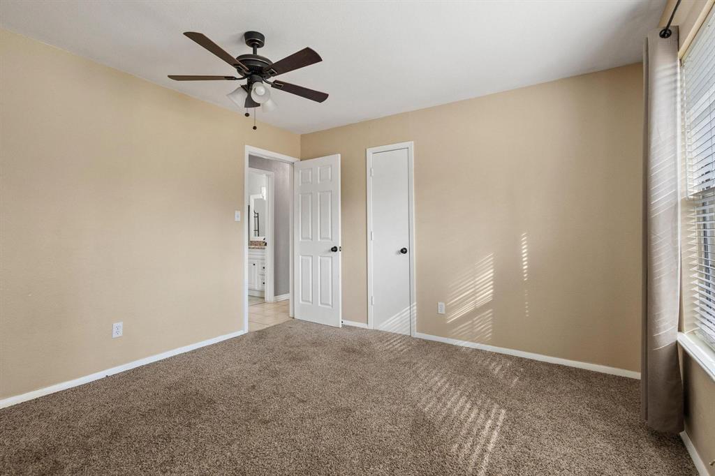 1223 Yowell Road Whitesboro, TX 76273 - Photo 16 of 30 a view of a livingroom with a ceiling fan and window