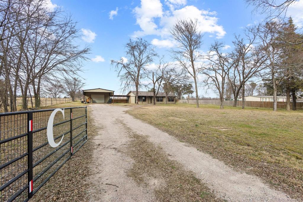 1223 Yowell Road Whitesboro, TX 76273 - Photo 2 of 30 a view of road with trees